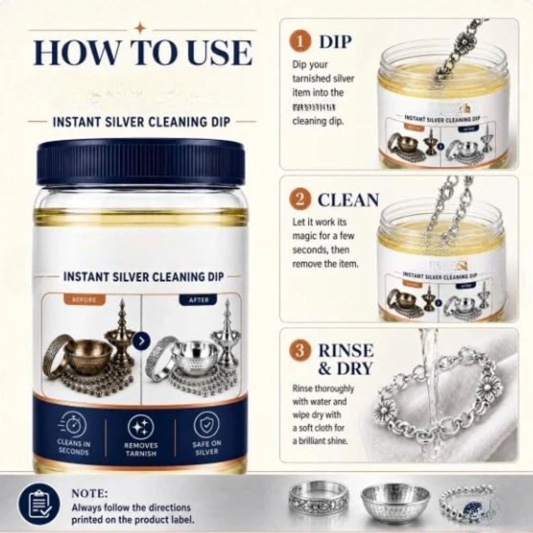 Tarnished silver being dipped into cleaning solution